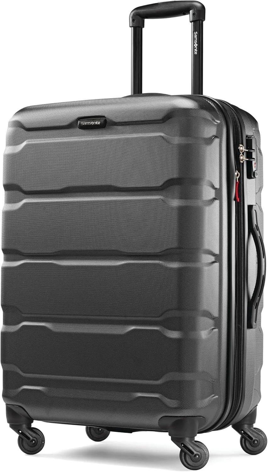 A matching three-piece Samsonite Omni PC hardside luggage set in black, nested from carry-on to large checked spinner