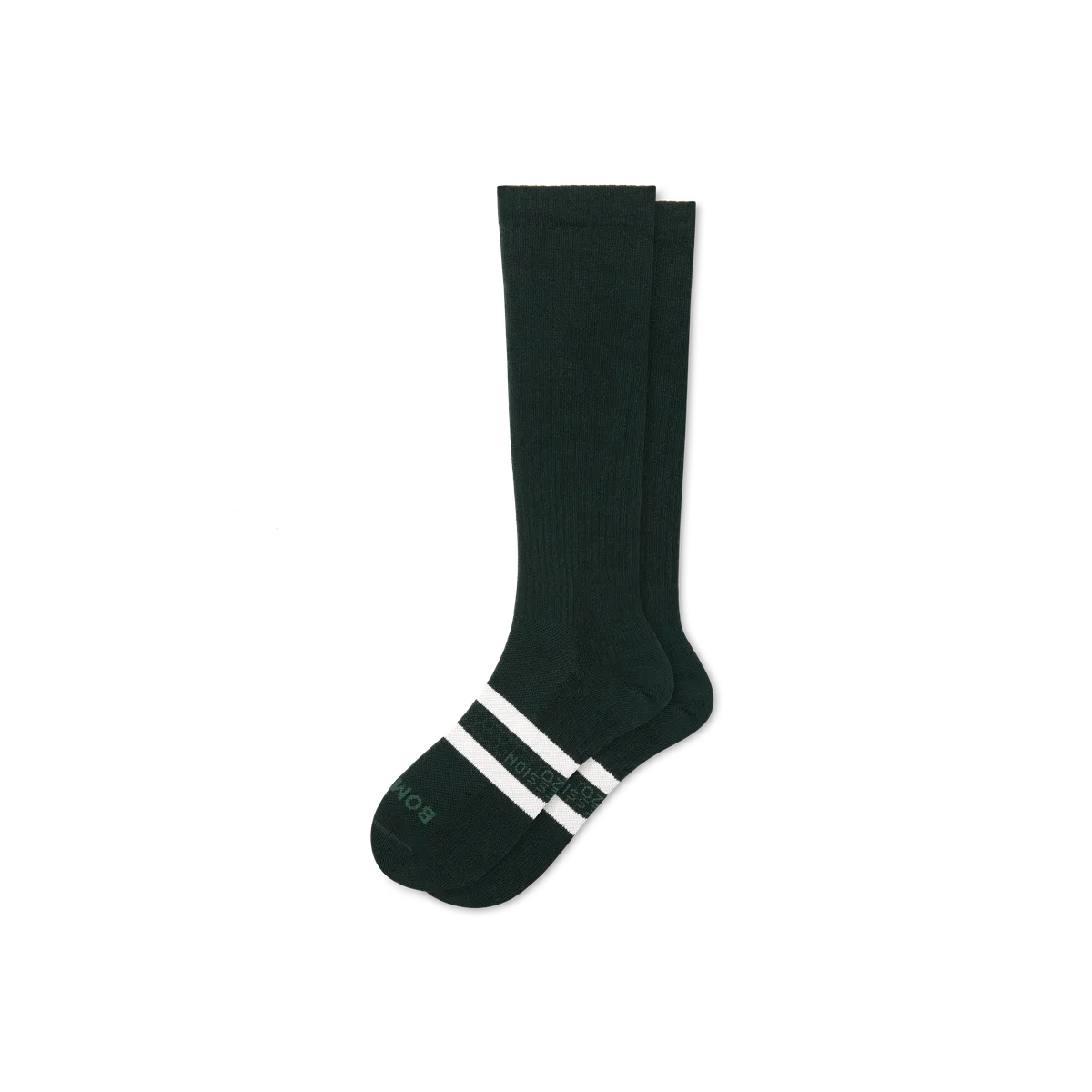 A pair of dark green Bombas everyday compression knee-high socks with white toe stripes
