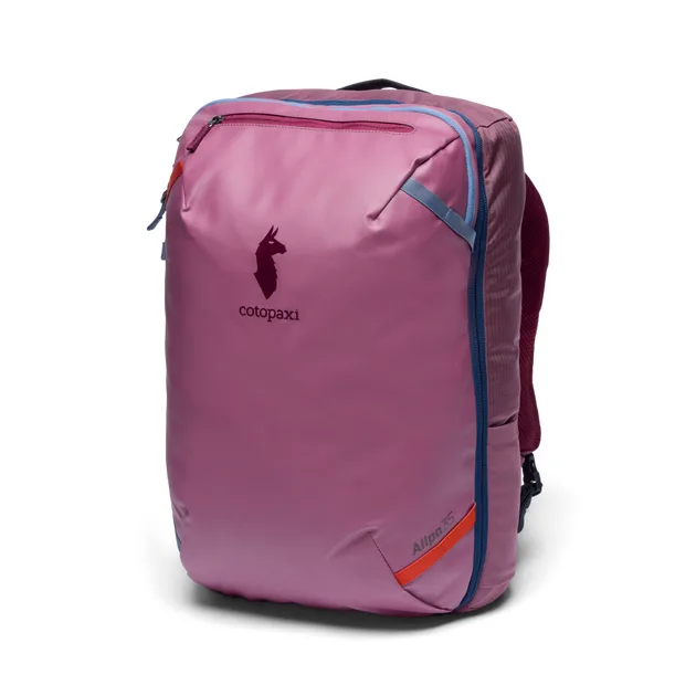 The Cotopaxi Allpa 35L travel pack in a magenta colorway, shown at a three-quarter angle with its llama logo visible