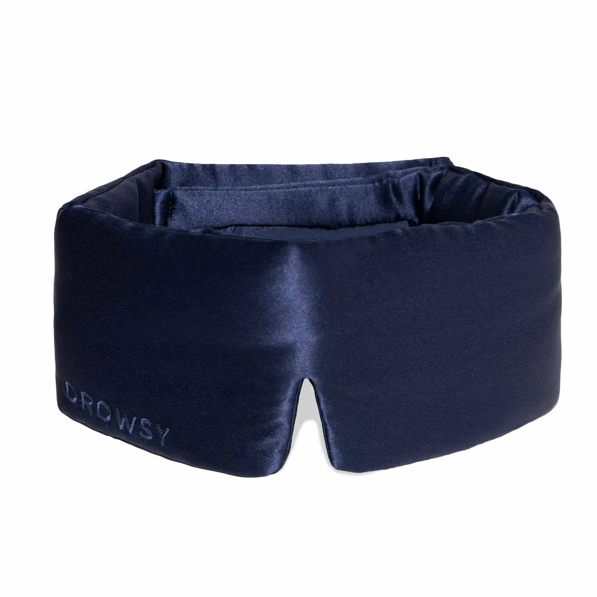 The navy Drowsy mulberry silk sleep mask with its wide padded band on a white background