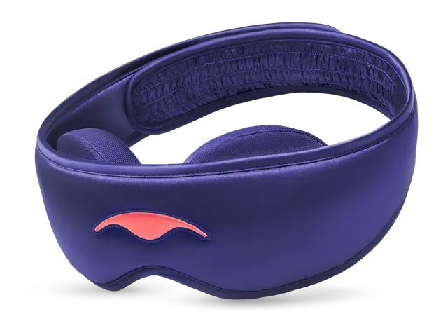 The Manta Silk Sleep Mask in blush mulberry silk with a contoured tapered shape and adjustable strap