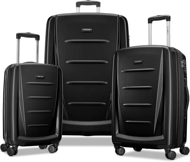 A three-piece Samsonite Winfield 2 hardside spinner set in brushed anthracite, three ribbed suitcases standing in a row