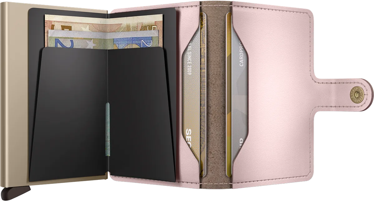 Rose leather Secrid Miniwallet open, with the aluminum cardprotector fanning several cards out