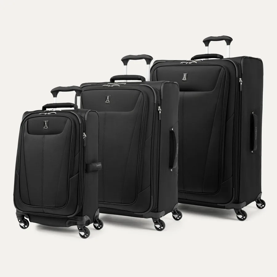 The Travelpro Maxlite 5 three-piece softside luggage set in black, with carry-on, medium, and large spinner suitcases lined up together