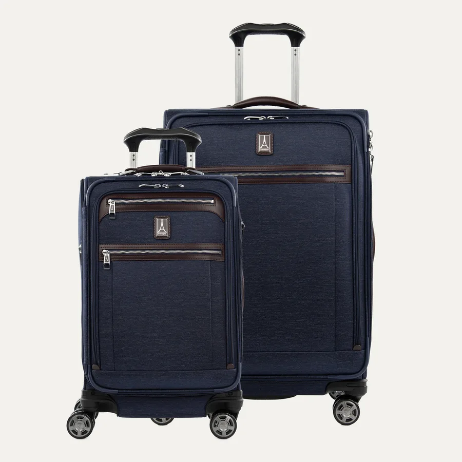 The Travelpro Platinum Elite two-piece set in true navy, a softside carry-on spinner and matching medium check-in suitcase with leather trim